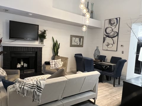 Living area | Smart TV, fireplace, books, computer monitors