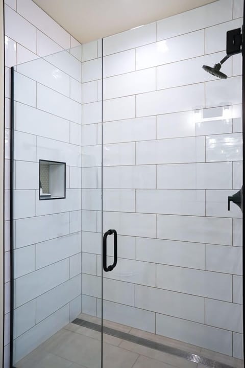 Combined shower/tub, hair dryer, towels, soap