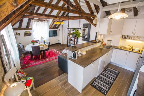 Modern kitchen with overview on traditional yet eclectic dining and living area