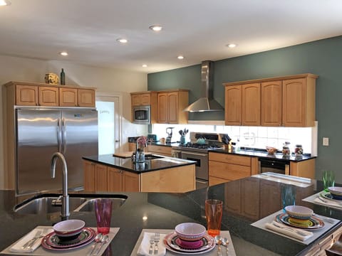 Kitchen is a dream for home cooks preparing for large gatherings.  Extra-Large capacity refrigerator and freezer, separate wine refrig, 2 sinks.