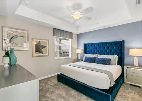 Master suite complete with a king-size bed, nautical decor, flat-screen tv, and an en-suite luxury bathroom