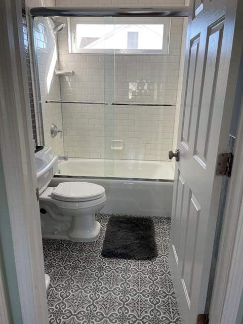 Combined shower/tub, hair dryer, towels, toilet paper