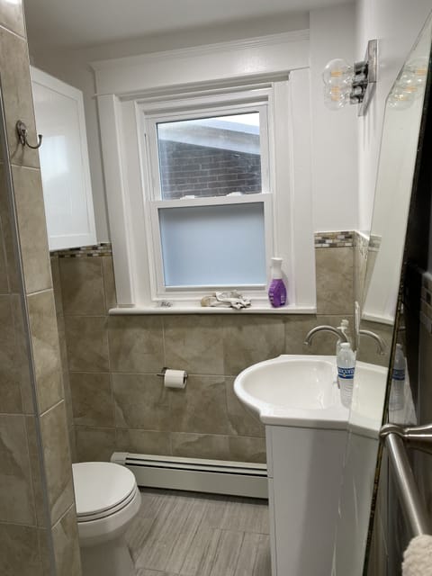 Combined shower/tub, hair dryer, towels, soap