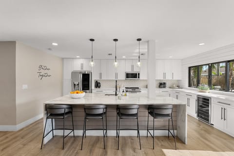 🍷 Pull up a stool for breakfast or a late-night glass of wine — this is where the day begins and ends.