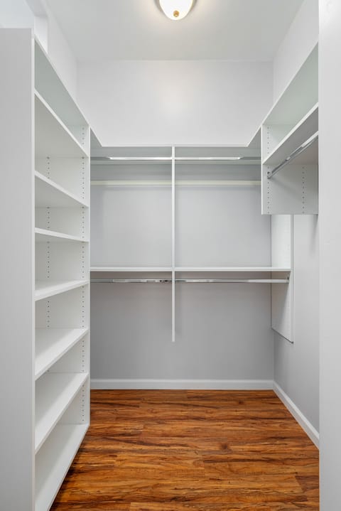 Master ensuite has a large walk-in closet for clothes storage.