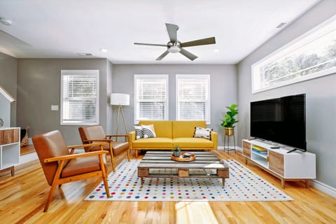 Living room. The yello couch has been replaced with a brand new brown leather co