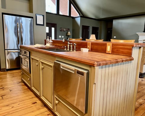 Kitchen island with bar seating for 3, convection oven, and dishwasher