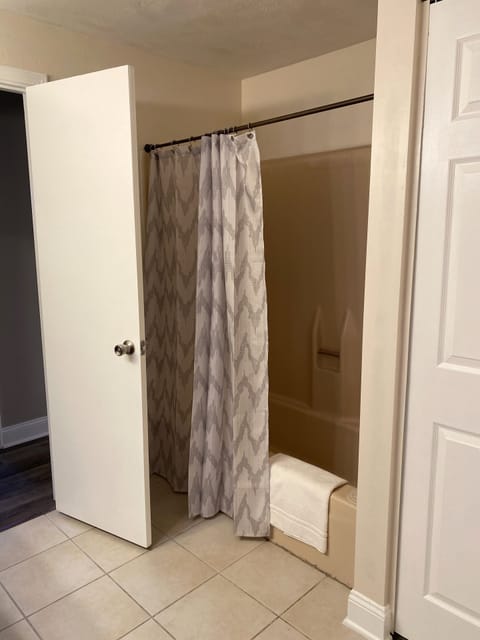 Combined shower/tub, hair dryer, towels, soap