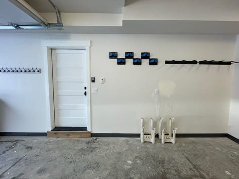 Garage with ski / board racks and boot dryers