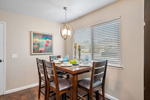 The dining table is central to the kitchen area.