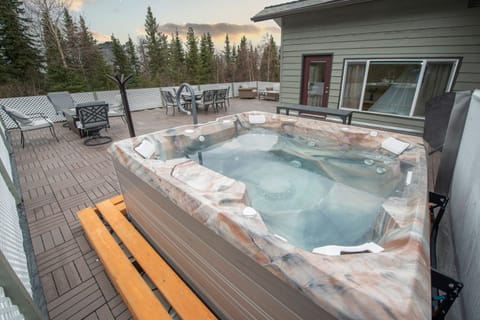 Enjoy your own private outdoor oasis with hot tub, fire pit, dining and lounges 