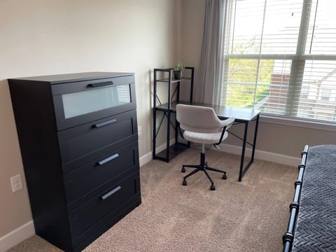 Plenty of dresser space to make yourself at home and a nice desk + office chair with nature view..