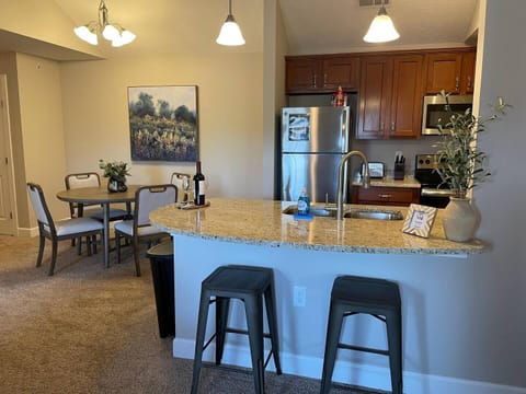 Open floor plan and vaulted ceilings makes this apartment feel very spacious! Plenty of seating.