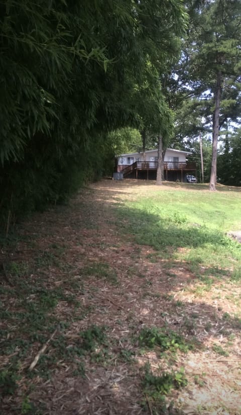Standing at lake looking at home. 