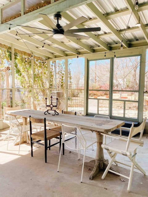 Enjoy the screened in porch w/ draped lights.  Perfect for coffee or happy hour!