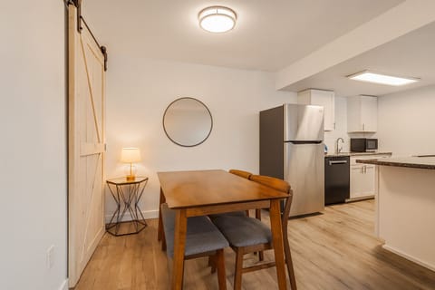 This dining space is seamlessly connected to the kitchen and the living room