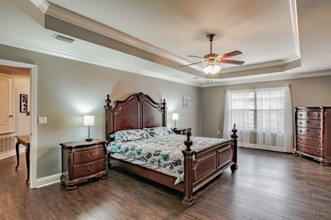 MASTER BEDROOM WITH KING BED, DRESSER, CHEST OF DRAWERS, 2 NIGHT STANDS, ARM CHAIR AND 50" SMART TV