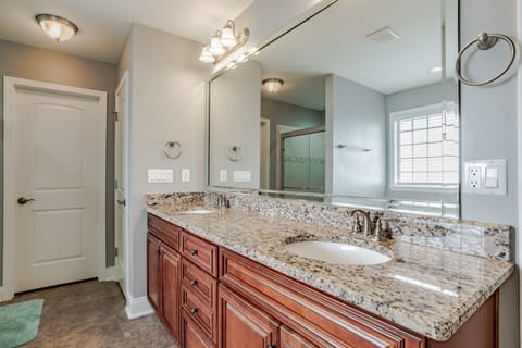 MASTER BATH SOAKER TUB, TILED WALK IN SHOWER, DOUBLE VANITY, 2 WALK IN CLOSETS AND A ENCLOSED TOILET AREA