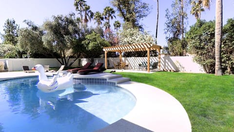 Fully fenced private oasis yard with salt water pebbletec pool, and cabana.