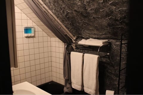 Combined shower/tub, hair dryer, towels, soap