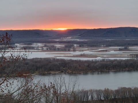 Sunset overlooking the river and bluffs towards Iowa
