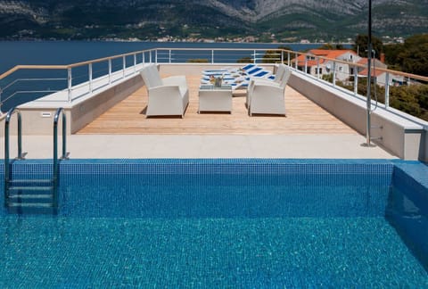 Outdoor pool, a rooftop pool, sun loungers