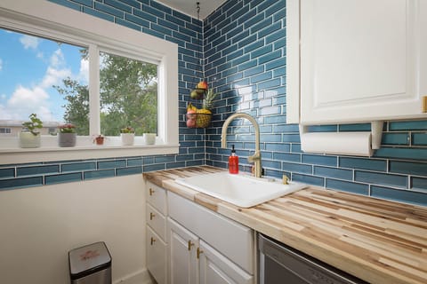 Combined shower/tub, hair dryer, towels, soap