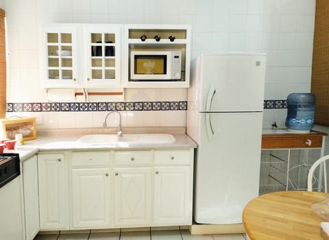 Fridge, microwave, stovetop, coffee/tea maker