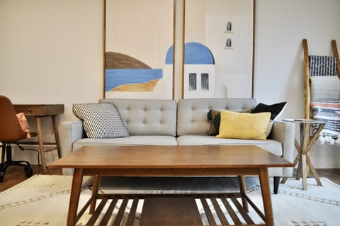 Living room with dedicated work space and a blanket ladder for comfort.