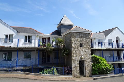 The back of the apartment block with secure gated parking.