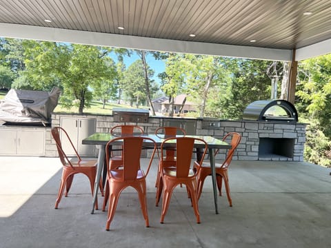 Professional outdoor kitchen with brick pizza oven.  