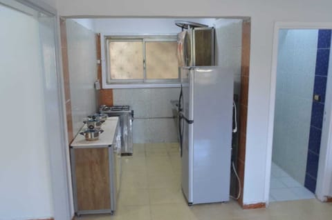 Fridge, stovetop, electric kettle, cookware/dishes/utensils