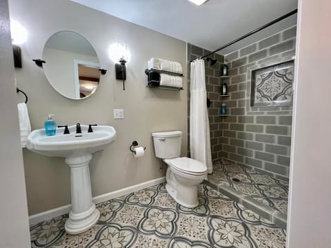 Bathroom | Bathtub, hair dryer, towels, soap