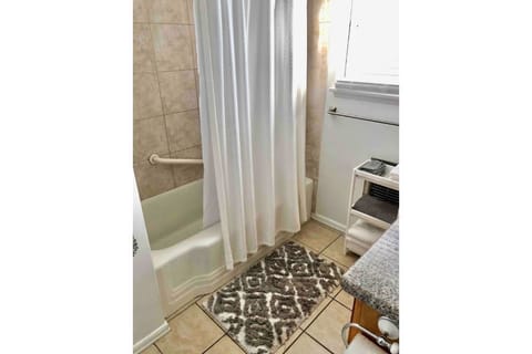 Combined shower/tub, hair dryer, towels, soap