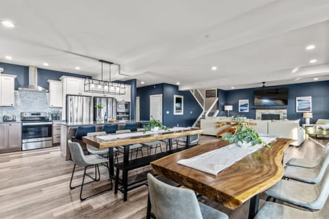 Huge open concept Great Room (kitchen/living/dining.) Hardwood floors, vaulted ceilings, large windows, tons of natural light. This enormous, fully-equipped kitchen has ample storage space, and everything you could ever want for the vacation of a lifetime.