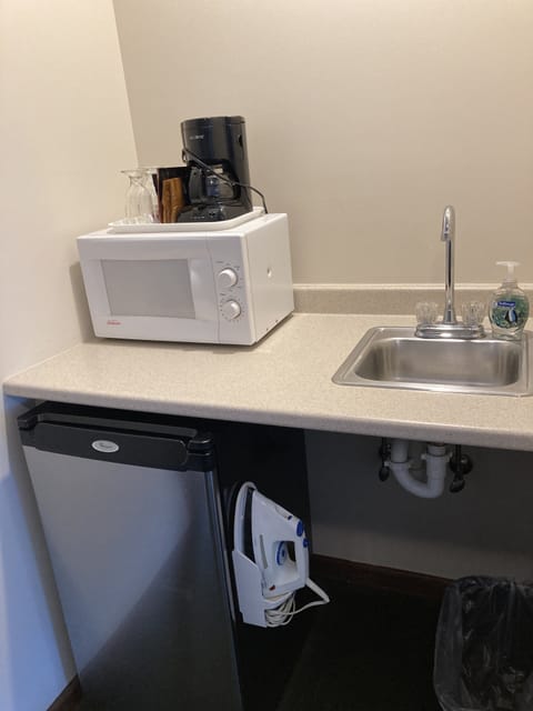 Kitchenette- microwave, coffee maker, fridge/freezer, iron/ironing board, sink