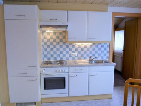 Cabinetry, Countertop, Sink, Building, Kitchen, Tap, Kitchen Stove, Floor, Flooring, Major Appliance