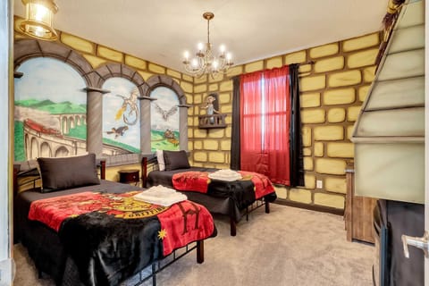 Hang out with a house elf and watch a dragon fight in your two twin beds