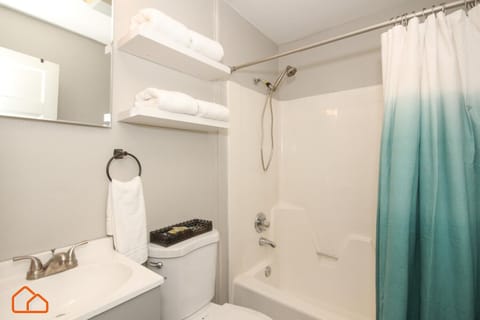 Combined shower/tub, hair dryer, towels, soap