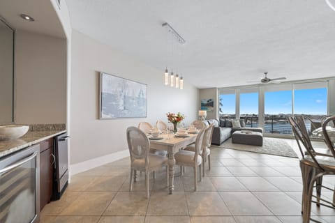 Coastal luxury redefined. Discover the open and inviting living spaces of this stunning bayfront condo.