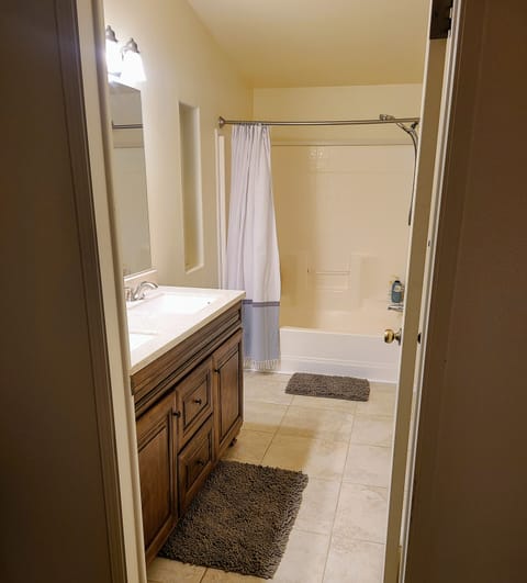 Combined shower/tub, hair dryer, towels, soap