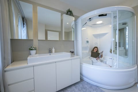 Combined shower/tub, jetted tub, hair dryer, bidet