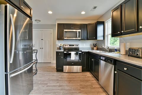 Kitchen is open and spacious and ready for you to whip up some delicious meals during your stay