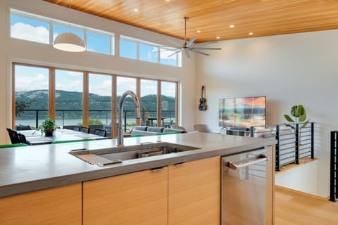 Kitchen looking South at living / dining room, and patio