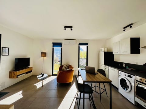 view of fitted kitchen, dining table, tv lounge
