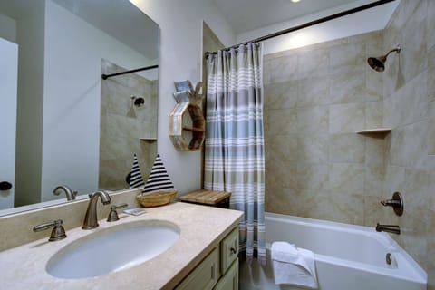 Combined shower/tub, hair dryer, towels, soap