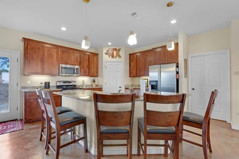 Bar seating for four is perfect for visiting with the cook.