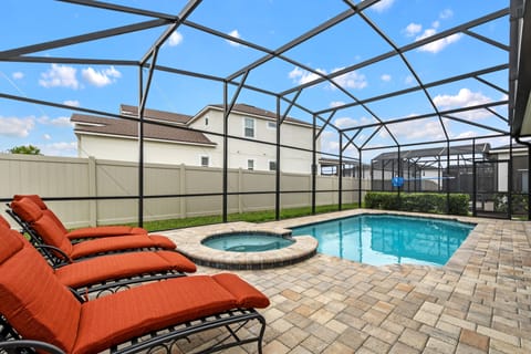 A heated pool, sun loungers