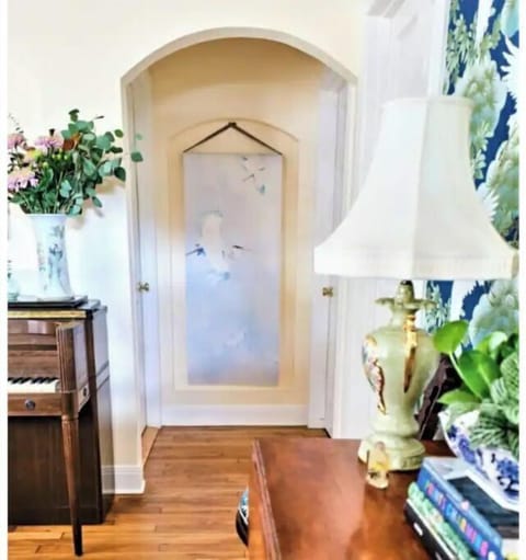 Small entryway with art niche between 2nd bedroom on right; bathroom on left.