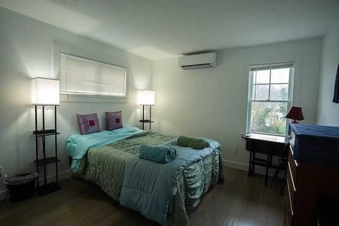 Bedroom one with bamboo floor.